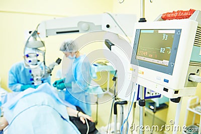 Surgeon doctors in operation room Stock Photo