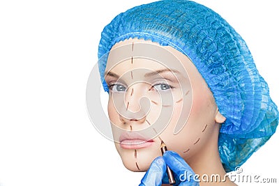 Surgeon drawing dotted lines on content patient Stock Photo