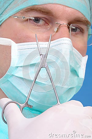 Surgeon with forceps Stock Photo