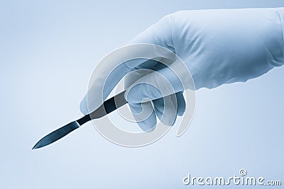 Surgeon hand with scalpel Stock Photo