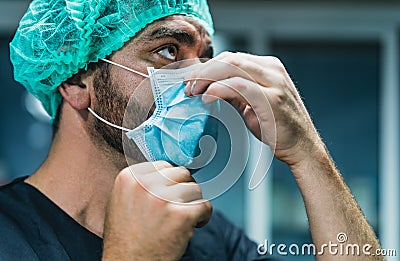 Surgeon preparing for surgical operation - Medical workers the real heroes during corona virus outbreak Stock Photo