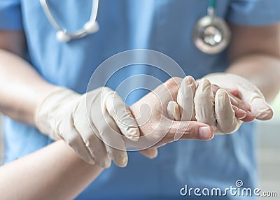 Surgeon, surgical doctor, anesthetist or anesthesiologist holding patient`s hand for health care trust and support in professional Stock Photo