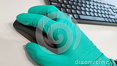 Surgeon surgical doctor on hygiene protective disinfection green glove clicking mouse, Researching and analysing in hospital labor Stock Photo