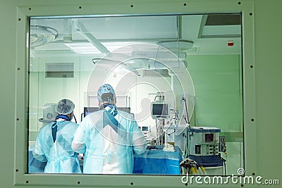 Surgeons perform surgery in the operating room. Stock Photo