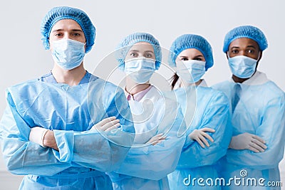 Surgeons Team Ready for Surgery. Practitioners Wearing Protective Uniforms Stock Photo