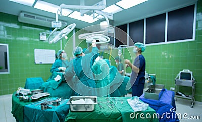 Surgeons team working with Monitoring of patient in surgical operating room. Stock Photo