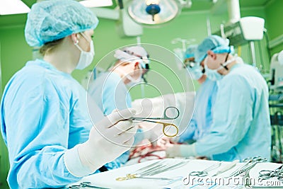Surgeons at work. female nurse operating in child surgery hospital Stock Photo
