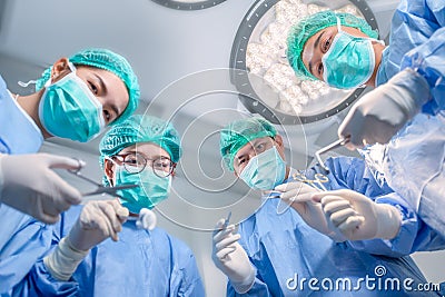 Surgery team operating in a surgical room Stock Photo