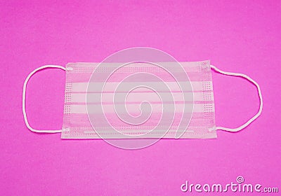 Surgical Ear-Loop Mask on Pink background Stock Photo