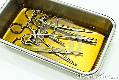 Surgical Instruments in Instrument Tray with chlorhexidine Solution Stock Photo