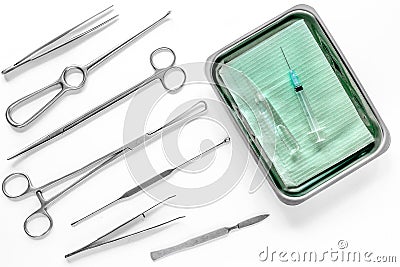 Surgical instruments and tools including scalpels, forceps and tweezers on white table top view Stock Photo