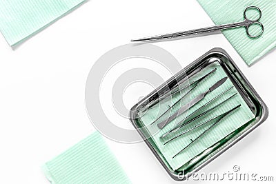 Surgical instruments and tools including scalpels, forceps and tweezers on white table top view copyspace Stock Photo