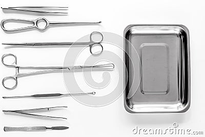 Surgical instruments and tools including scalpels, forceps and tweezers on white table top view mock up Stock Photo