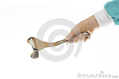 Surgical retractor held by surgeons hand Stock Photo