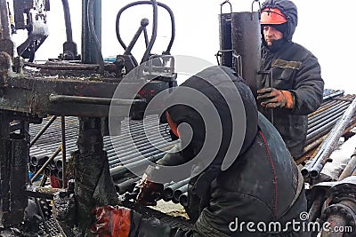 Drilling work at the well. drill rig, rotation of drill pipe Editorial Stock Photo