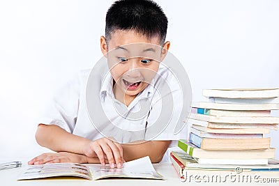 Surprise Asian Chinese Little Boy Wearing Student Uniform Reading Textbook Stock Photo