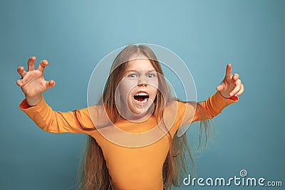 The surprise. Teen girl on a blue background. Facial expressions and people emotions concept Stock Photo