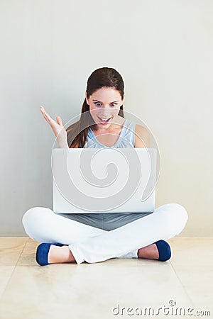 Surprise, woman and laptop on floor for good news, social media or winning prize at home. Shocked female person or Stock Photo