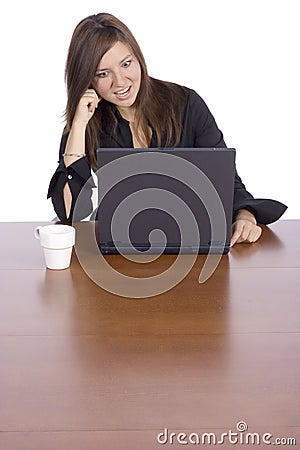 Surprise woman at the table with notebook Stock Photo