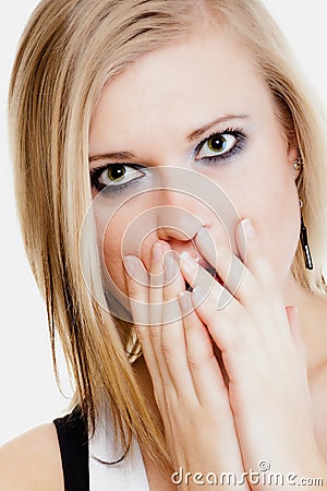 Surprised afraid girl covering mouth with hand Stock Photo