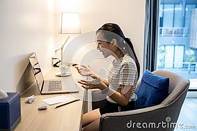 Surprised asian student getting exam results,pass exams looking excited,happy teen schoolgirl read good news while sit at work Stock Photo