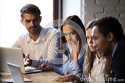 Surprised baffled diverse colleagues received bad news by email Stock Photo