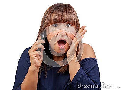 Surprised brunette woman talking mobile phone isolated Stock Photo