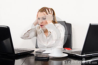 Surprised business woman multitasking Stock Photo