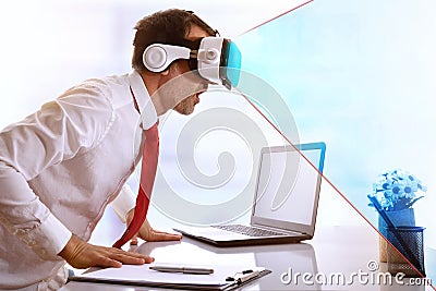 Surprised businessman using virtual reality glasses with blue vi Stock Photo