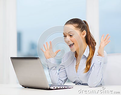 Surprised businesswoman with laptop Stock Photo