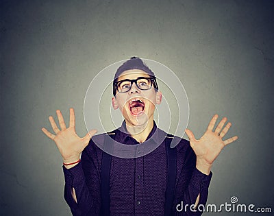 Surprised excited funky looking man screaming Stock Photo