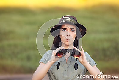 Surprised Explorer Girl with Camouflage Hat and Binoculars Stock Photo