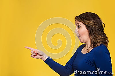 Surprised female pointing out at copy space Stock Photo