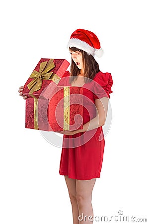 Surprised festive brunette holding a gift Stock Photo
