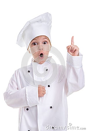 Surprised girl chef white uniform isolated on white background, looking straight at the camera with a poining finger up Stock Photo