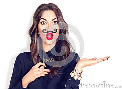 Surprised girl holding funny mustache on stick Stock Photo