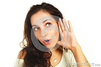 Surprised girl listening to something Stock Photo