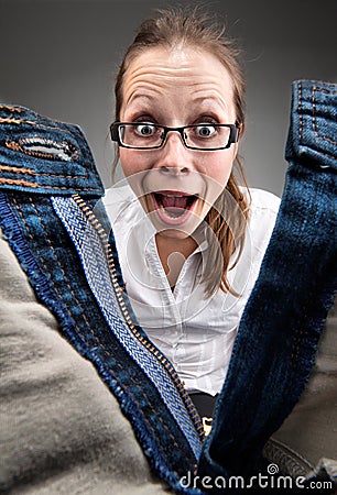 Surprised girl looking inside unzipped pants Stock Photo