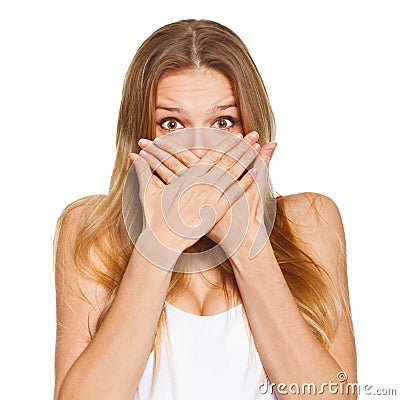 Surprised happy beautiful woman covering her mouth with hand. isolated over white Stock Photo