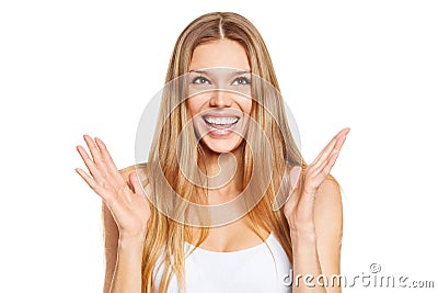 Surprised happy beautiful young woman looking up in excitement. Isolated over white Stock Photo