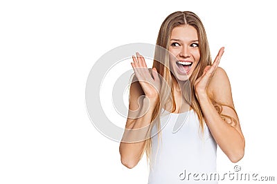 Surprised happy young woman looking sideways in excitement. Isolated over white Stock Photo