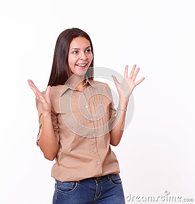 Surprised hispanic girl with brown blouse standing Stock Photo