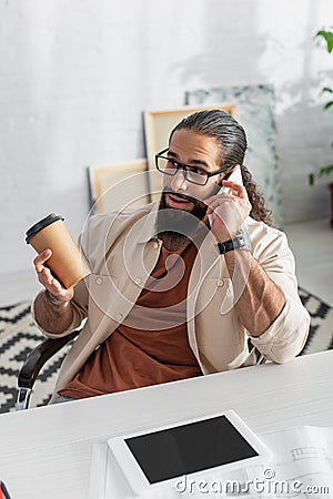 surprised hispanic man with coffee to Stock Photo