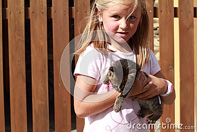 Surprised little girl with a kitty Stock Photo
