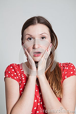 Surprised looking attractive woman Stock Photo