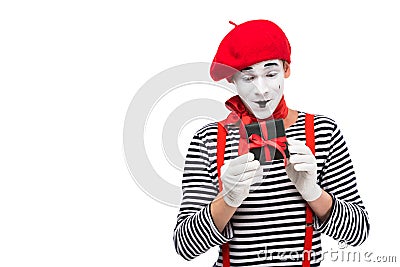 surprised mime looking at present box Stock Photo