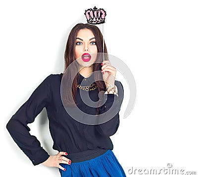 Surprised model girl holding funny crown on stick Stock Photo