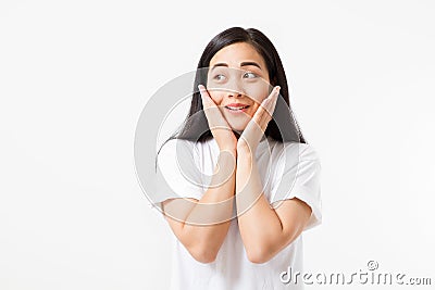 Surprised shocked excited asian woman face isolated on white background. Young asian girl in summer t shirt. Copy space. Stock Photo