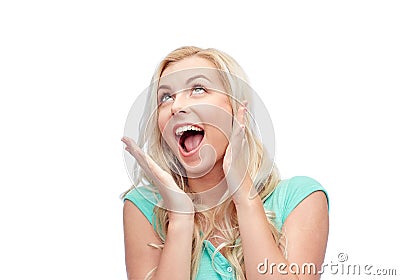 Surprised smiling young woman or teenage girl Stock Photo