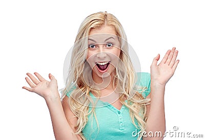 Surprised smiling young woman or teenage girl Stock Photo